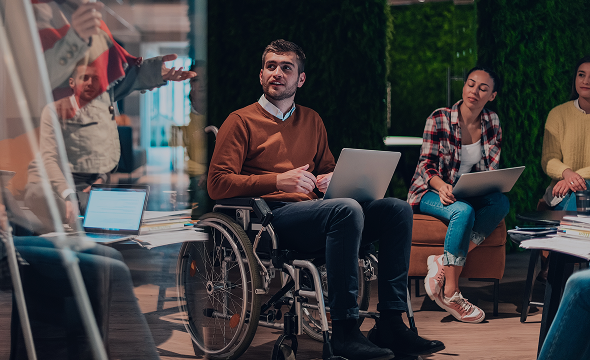Boy working in a wheelchair